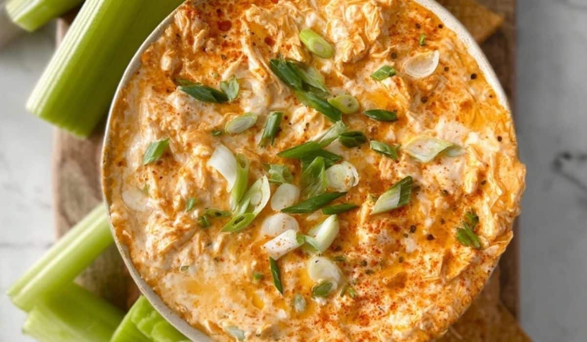 Greek Yogurt Buffalo Chicken Dip served with celery sticks