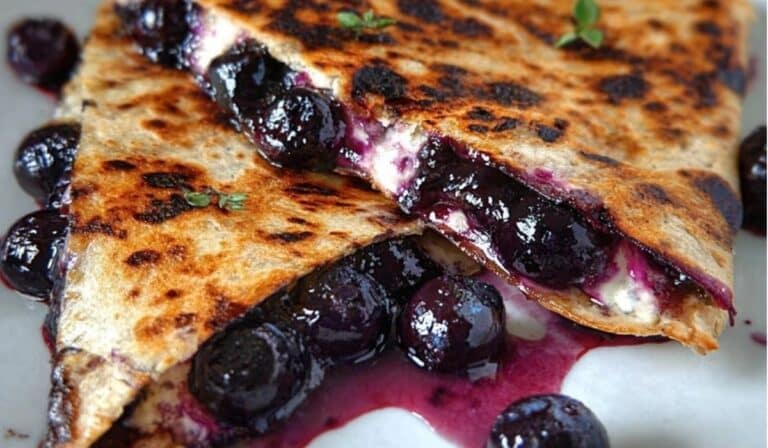 Blueberry Breakfast Quesadilla served hot with melted cream cheese and bursting blueberries