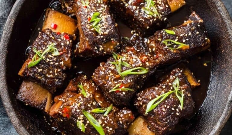 Easy Korean Slow Cooker Short Ribs glazed with sweet soy sauce and topped with sesame seeds