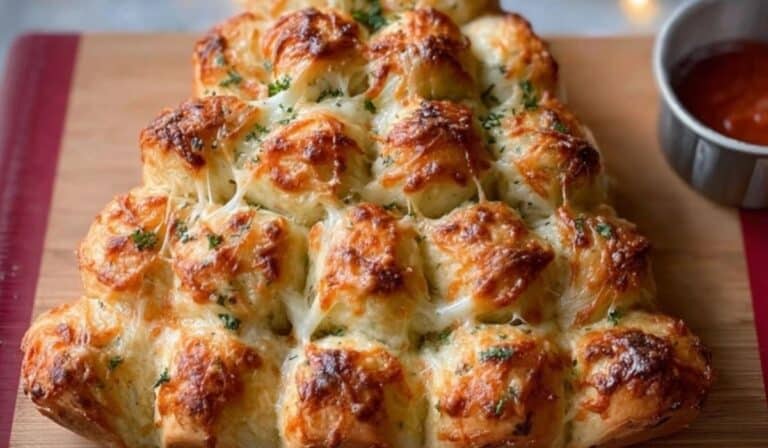 Cheesy Pull-Apart Christmas Tree Bread baked golden with herbs and cheese