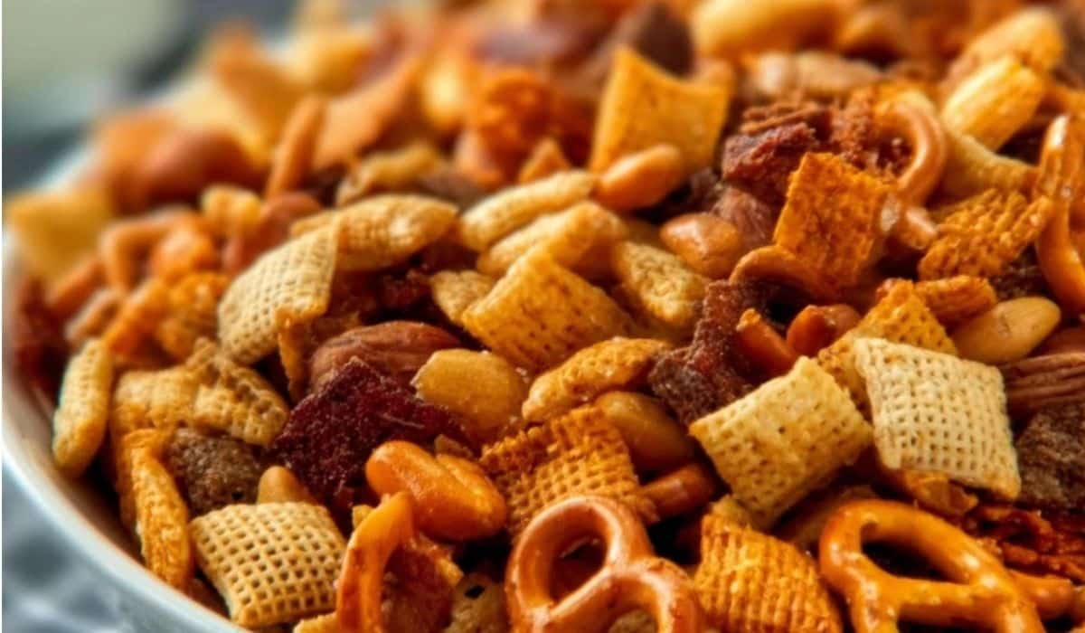Party Snack Mix close-up with cereal, pretzels, nuts, and seasoning
