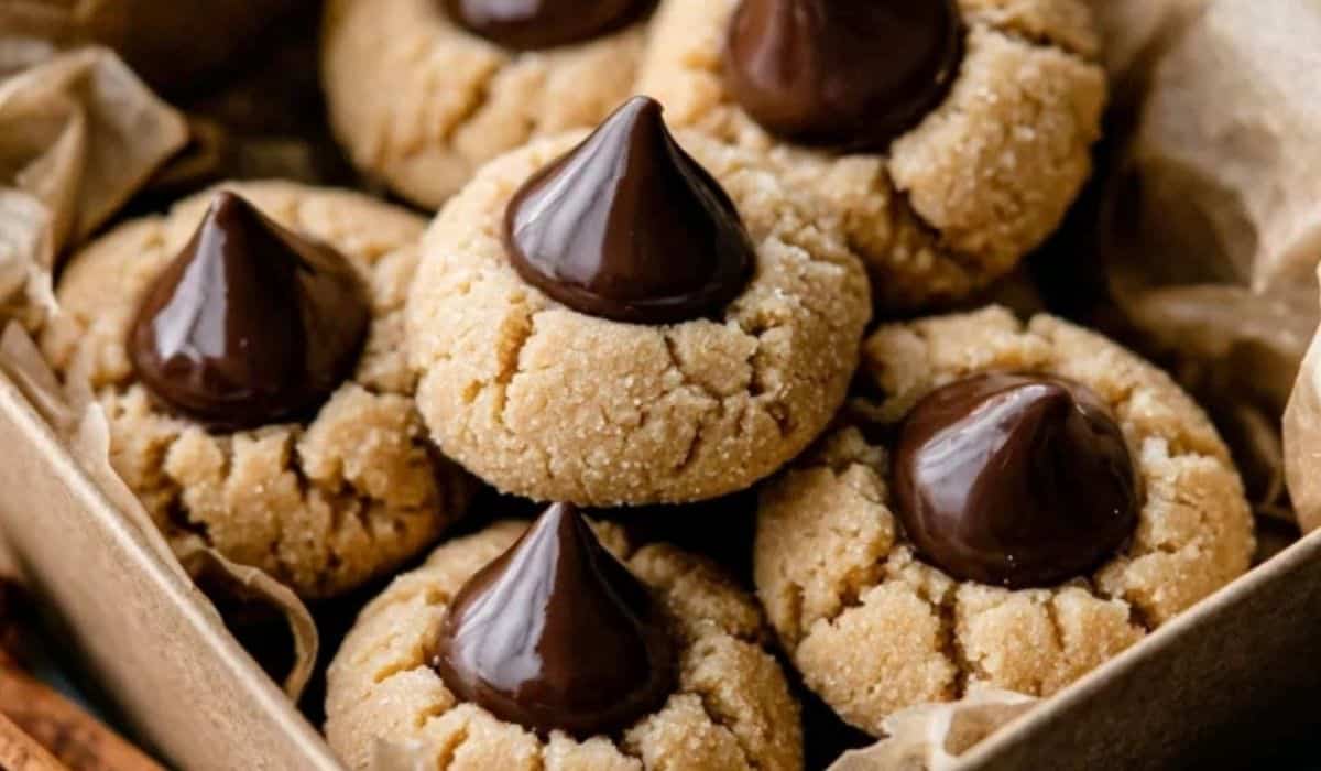 Classic Peanut Butter Blossoms in a rustic box topped with chocolate kisses