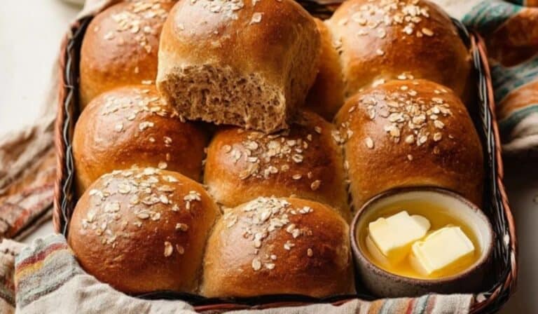 Fluffy golden brown dinner rolls in a rustic bread basket