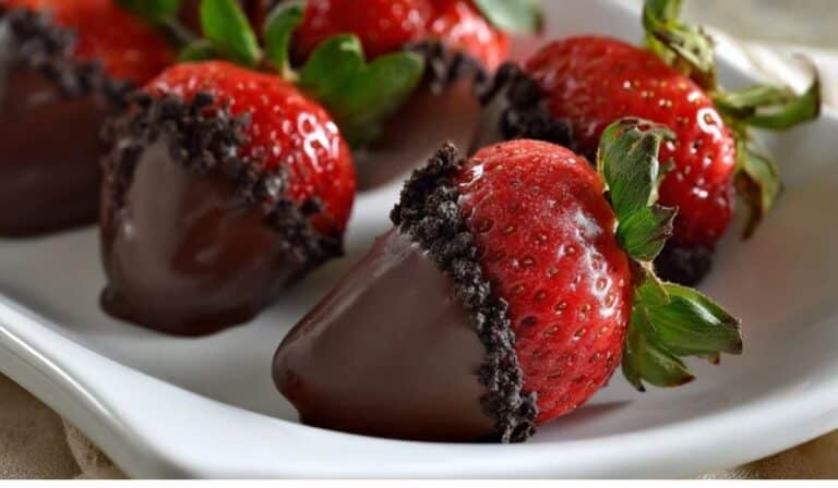 Oreo Truffle-Stuffed Strawberries served on marble tray with natural light