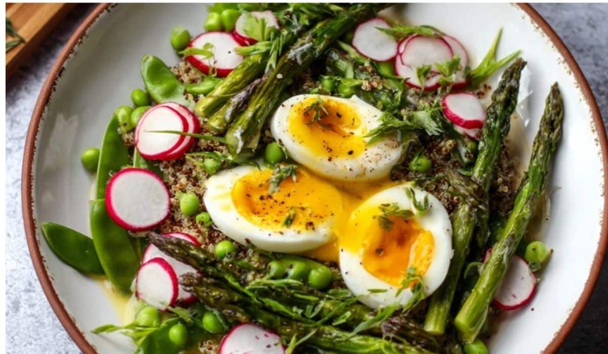 Asparagus and egg spring bowl with quinoa, avocado, radishes, and jammy eggs