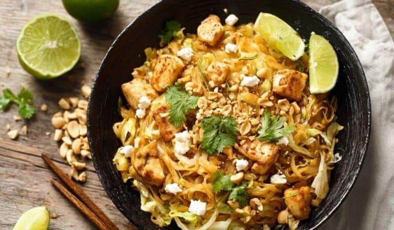 Cabbage pad thai noodle substitute served with peanuts, lime, and shrimp